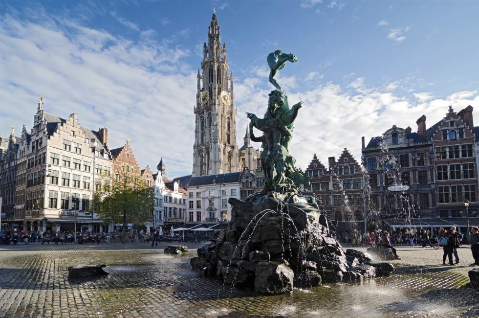 ANTWERP, BELGIUM - OCTOBER 26: The Grand Place with the Statue of Brabo, throwing the giant's hand into the Scheldt River and the Cathedral of our Lady.  on October 26, 2013 in  in Antwerp, Belgium. 