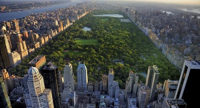 Central Park aerial view, Manhattan, New York; Park is surrounded by skyscraper.