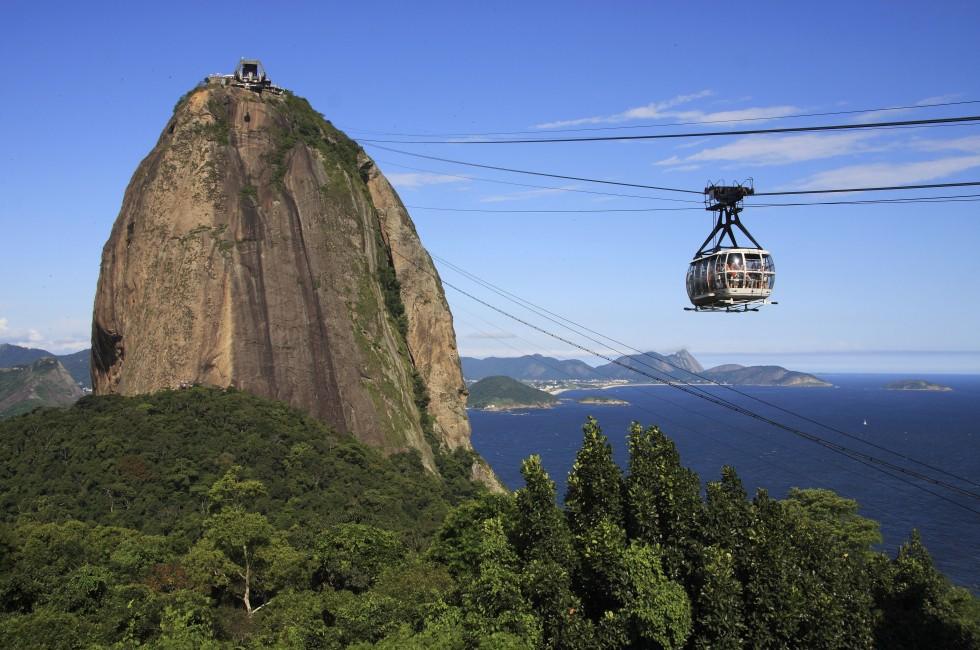 Brazil, Rio de Janeiro, Sugar Loaf Mountain - Pao de Acucar and cable car with the bay and Atlantic Ocean in the background.; 