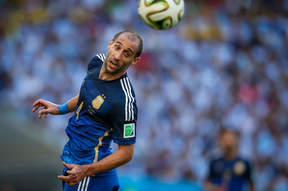 RIO DE JANEIRO, BRAZIL - July 13, 2014: Zabaleta of Argentina competes for the ball during the World Cup Final game between Argentina and Germany at Maracana Stadium. NO USE IN BRAZIL.