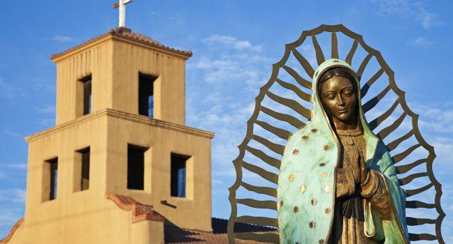 Mary Of Guadalupe in front of Sanctuary Of Guadalupe, Santa Fe, New Mexico.