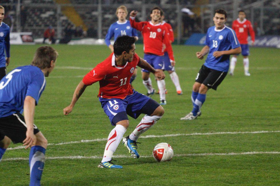 SANTIAGO, CHILE - JUNE 19: Luis Jimenez from Chile (red n11) during a friendly soccer match played between Chile and Estonia at 19th of June, 2011 in Santiago Chile.
