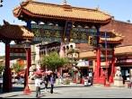 Chinatown,Victoria,B.C.,Circa,May,2014.The gates of Harmonious Interest guard Canada's oldest chinatown.Many fine restaurants,shops  the famous fantan alley,Canada's smallest alley.Come enjoy return