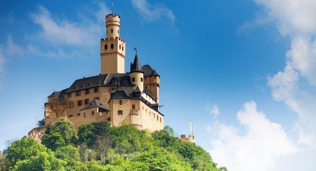 View Marksburg castle in Germany, Europe over blue sky on top of the high mountain.