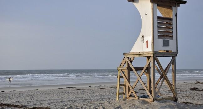 wooden lifeguard tower overlooking the Atlantic surf at Wrightsville Beach in Wilmington, North Carolina.