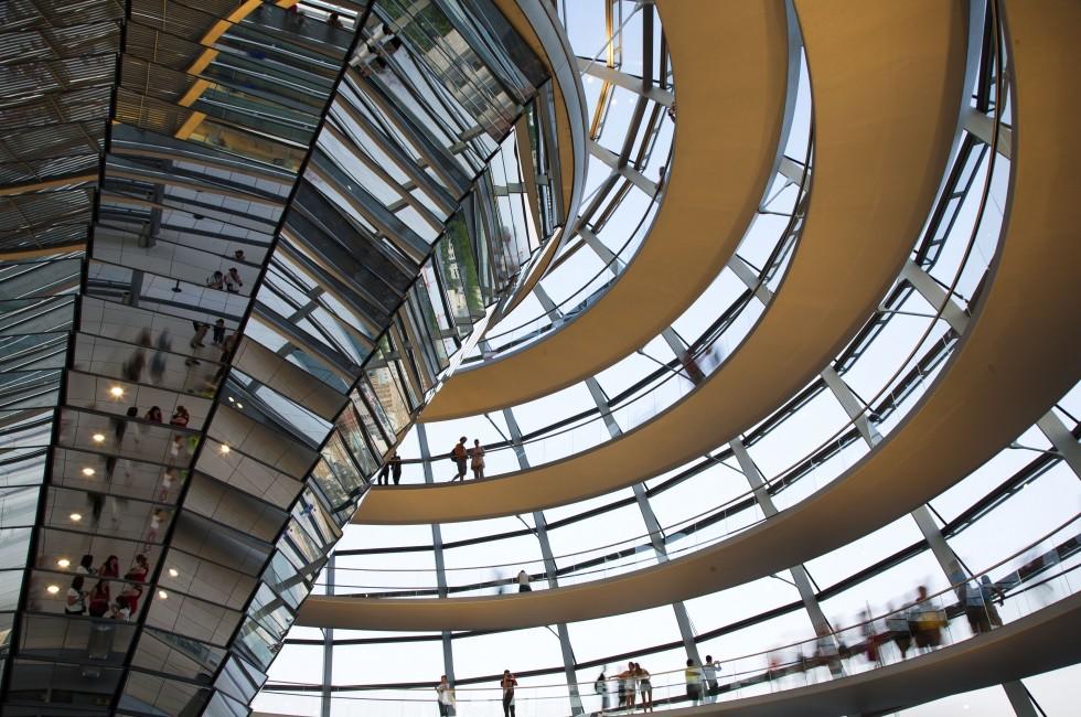 BERLIN, GERMANY - JULY 21, 2013:Tourists inside the glass dome of the Reichstag in Berlin, Germany; July 21, 2013 