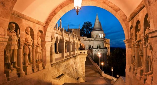 The south gate of the Fisherman's Bastion in Budapest - Hungary at night