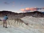 Landscape photographer taking pictures at sunrise in Death Valley national park in California.; 