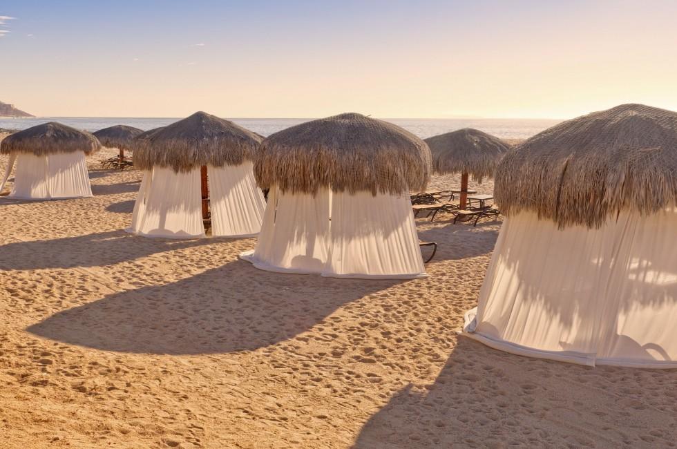 Tiki Huts and Massage Tents on Beach.