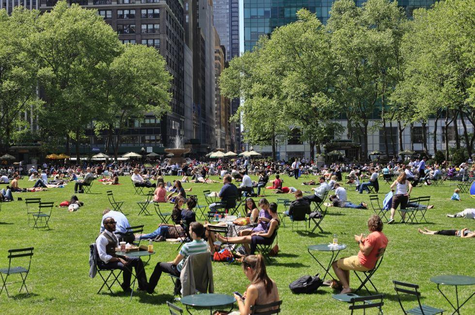 NEW YORK, USA - MAY 16: People enjoying a nice day in Bryant Park on May 16, 2013 in New York City, NY. Bryant Park is a 9,603 acre privately managed park in the center of Manhattan.