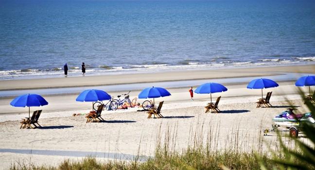 Hilton Head Island, South Carolina beach landscape - rental umbrellas, bikes and chairs.