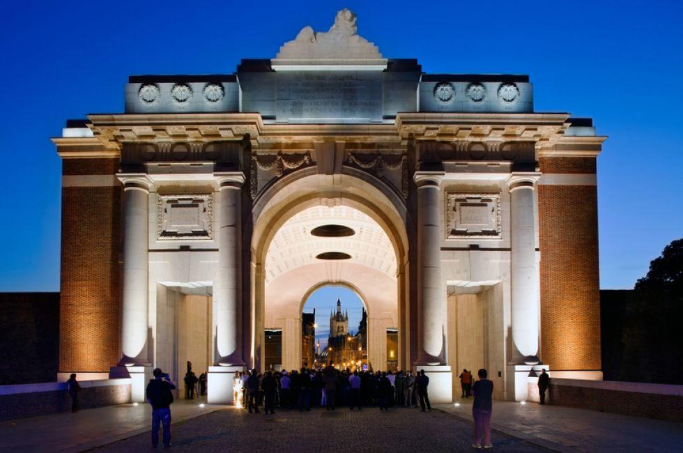 IEPER (YPRES), BELGIUM - SEPTEMBER 24: The Last Post is played under the Menin Gate by the Royal Scots Guards as a precursor to the opening of the Ypres Military Tattoo, on September 24, 2011 in Ypres, Belgium.