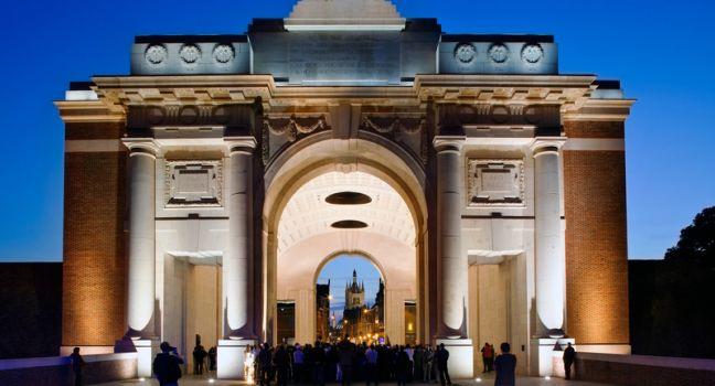 IEPER (YPRES), BELGIUM - SEPTEMBER 24: The Last Post is played under the Menin Gate by the Royal Scots Guards as a precursor to the opening of the Ypres Military Tattoo, on September 24, 2011 in Ypres, Belgium.