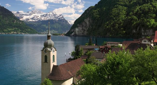 Looking over the church in Bauen onto Lake Lucerne in Switzerland.; 