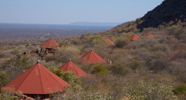 WATERBERG, NAMIBIA - JULY 24, 2013: Red roofs of the Waterberg Plateau Lodge in Namibia nestling high on the slope of Waterberg with views across the endless Kalahari.  ; Shutterstock ID 194748248; Project/Title: Namibia; Downloader: Fodor's Travel