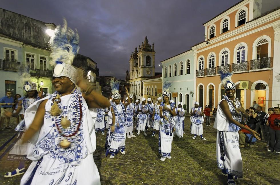 samba dancers in front iglesias rosario dos pretos in pelourinho area in the beautiful city of salvador in bahia state brazil; 