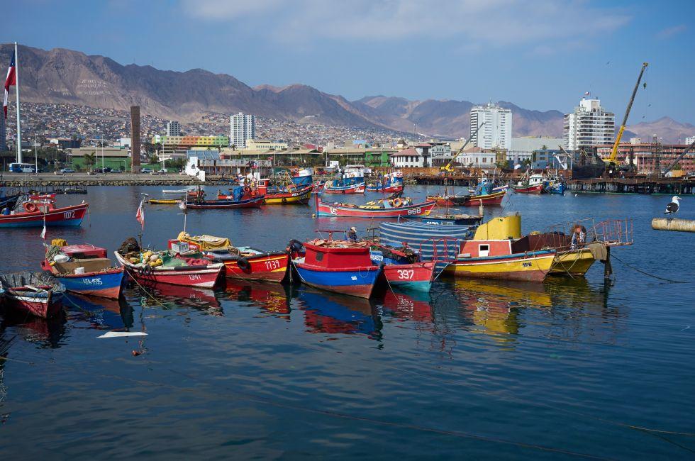 ANTOFAGASTA, CHILE - JUNE 21, 2014: Colourful wooden fishing boats in the harbour at Antofagasta in the Atacama Region of Chile