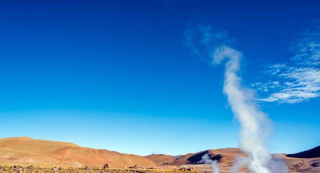 Steam rising out of the ground at the El Tatio Geyser field near San Pedro de Atacama, Chile