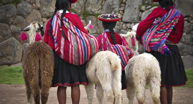 Peruvian Girls and Alpacas at Sacsayhuaman, Cusco Peru; 