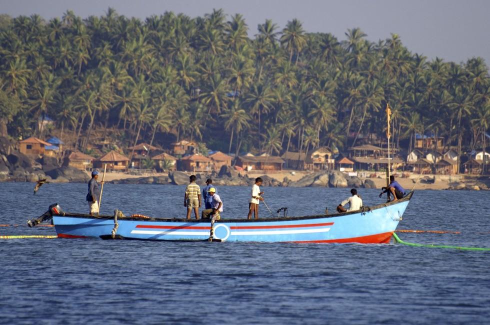 Indian fishermen on the boat, Palolem, Goa state, India.