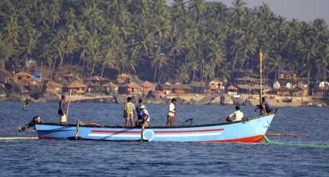 Indian fishermen on the boat, Palolem, Goa state, India.