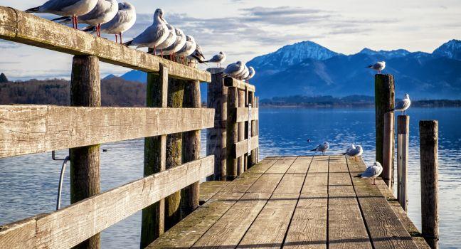old wooden jetty at the chiemsee lake in bavaria