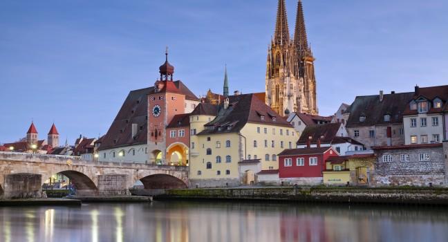 Regensburg, Germany; Regensburg. Image of unesco heritage and historic bavarian city Regensburg with cathedral and old stone bridge over river Danube in Germany.; 