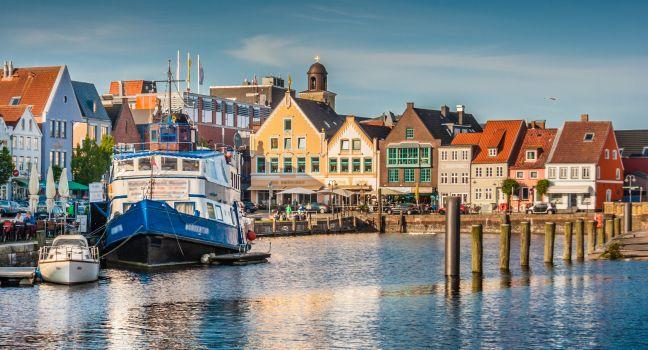 Beautiful view of the old town of Husum, the capital of Nordfriesland and birthplace of German writer Theodor Storm, in Schleswig-Holstein, Germany.