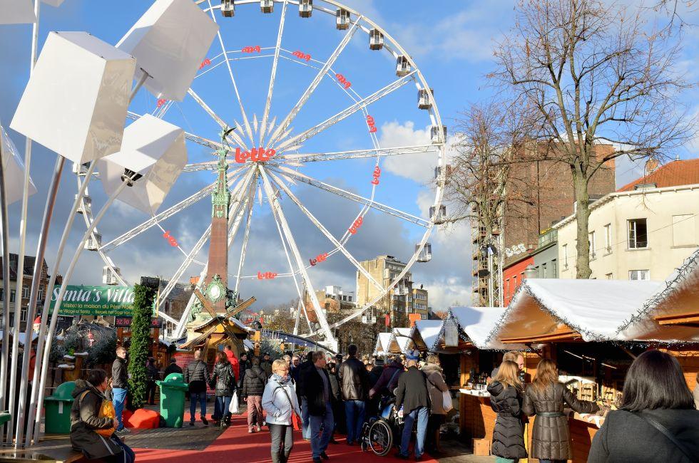 BRUSSELS, BELGIUM-DECEMBER 6, 2014: People crowded very popular Christmas market on square Vismet.