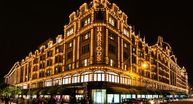 LONDON, UK - SEPTEMBER 25, 2014: The famous Harrods department store in the evening of September 25, 2014 at Knightsbridge in London, UK. Harrods is the biggest department store in Europe and offers