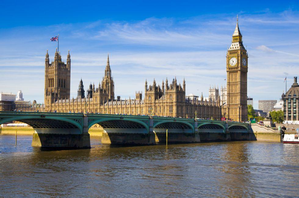 LONDON, UK - JUNE 24, 2014 - Big Ben and Houses of Parliament on Thames river.