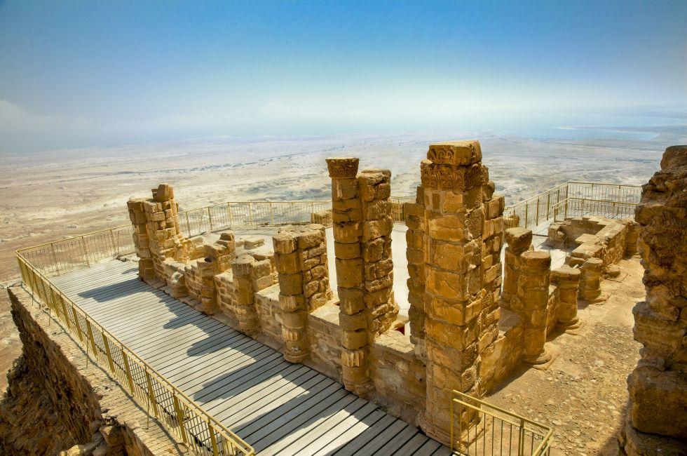 Ruins of ancient fortress Masada. Dead Sea is at background. Masada is the name for ancient palaces and fortifications in the South District of Israel on top of an isolated rock plateau. Israel; 