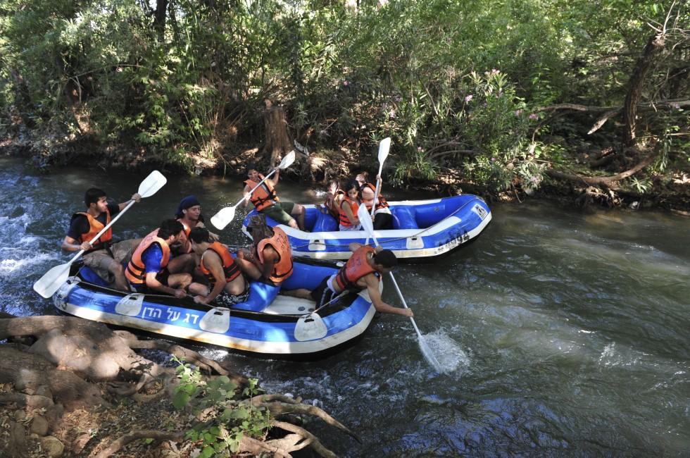 DAN RIVER, ISR - MAY 20:Young Israeli people river rafting on Dan River on May 20 2009.It's the largest of the three principal tributaries of the Jordan River.; Shutterstock ID 141593782; Project/Title: Fodors Israel; Downloader: Melanie Marin