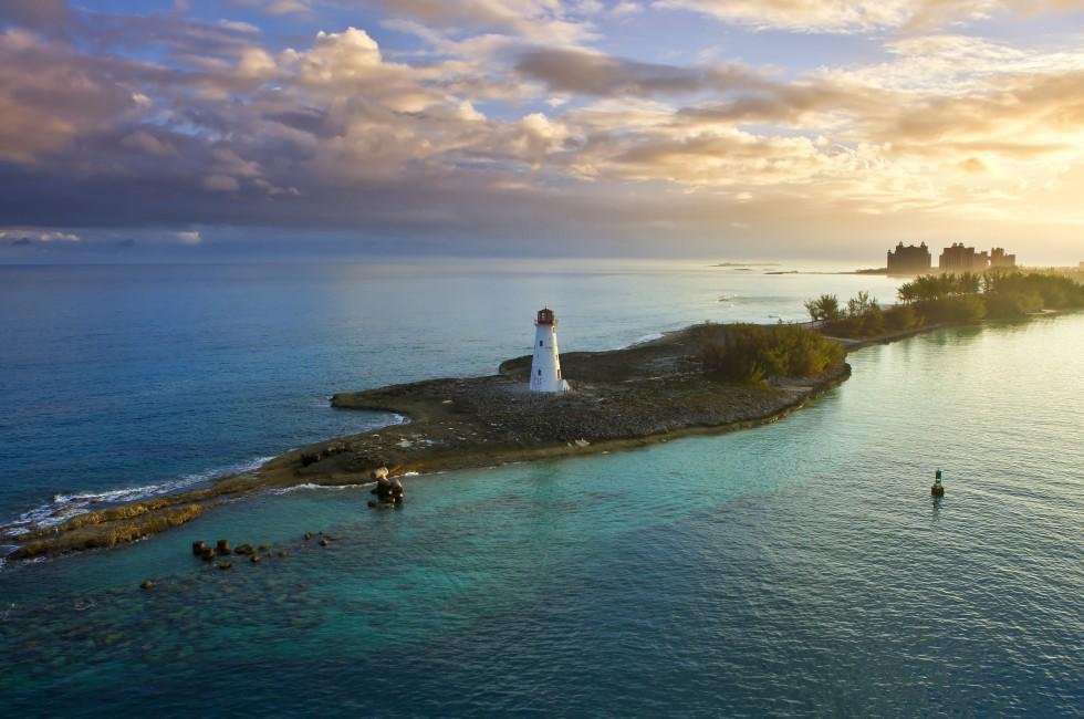 nassau bahamas, lighthouse, and paradise island at dawn.
