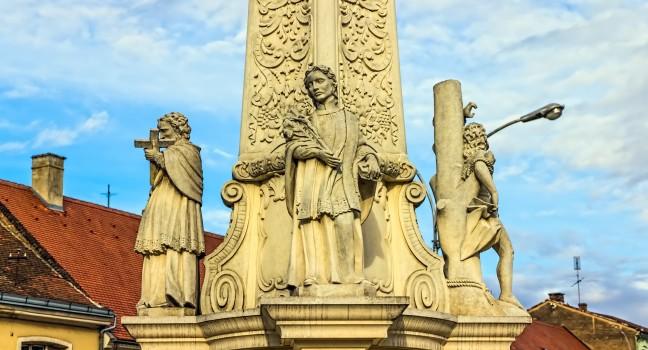 Votive column detail from baroque period in Pozega main square, Croatia.