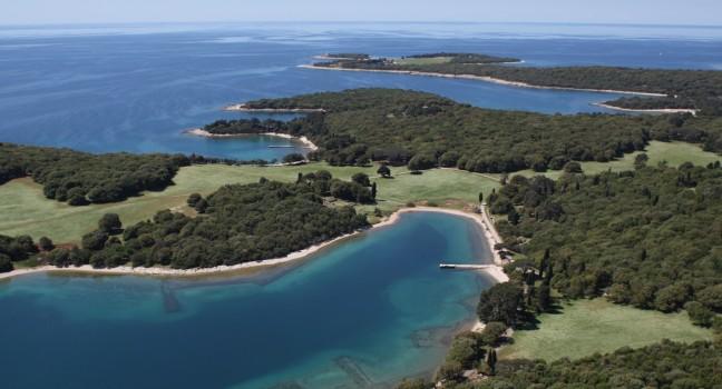 National park Brijuni  are a group of fourteen small islands in the Croatia part of the northern Adriatic Sea , bay Verige with old Roman monuments - aerial view