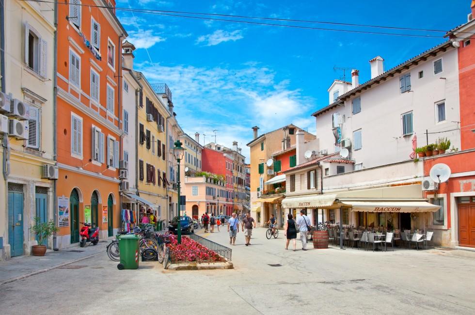 ROVINJ, CROATIA - JULY 3: People walk the old town streets on July 3, 2013 in Rovinj, Croatia.Total 6.6 million tourists holidayed in Croatia from January to July 2013.