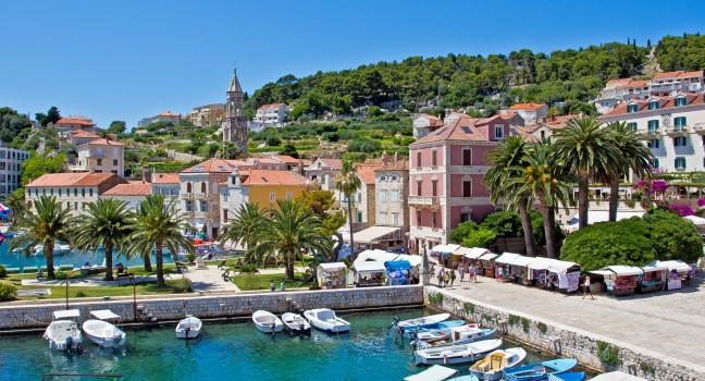 European Cityccape. Bay, Boat, Mountain, Sea and Sky. Hvar. Croatia. High quality stock photo.