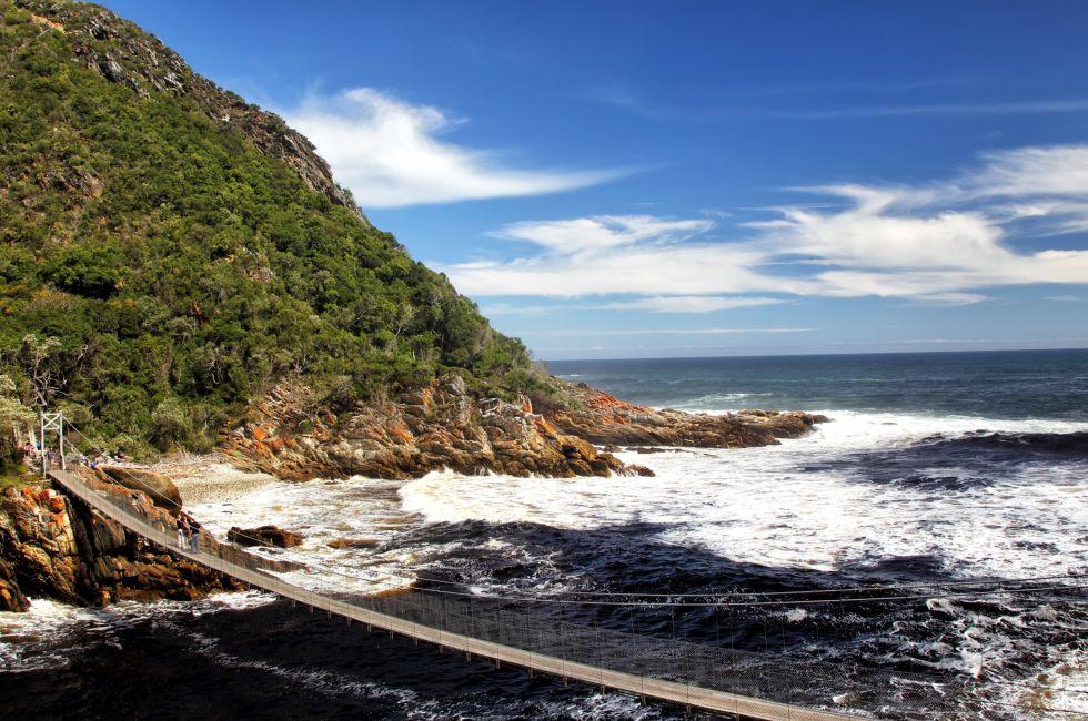 Suspension bridge over the river mouth of the Storms River in the Tistsikamma National Park, South Africa.