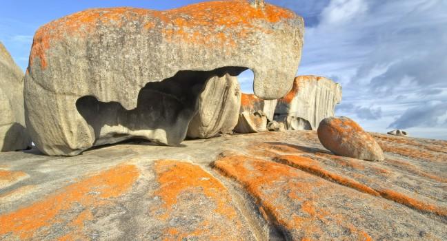 Early morning light on the Remarkable Rocks, Kangaroo Island, Australia. The rocks are remains of an ancient lava dome that pushed through the surface. Erosion leaves strangely formed rocks behind.