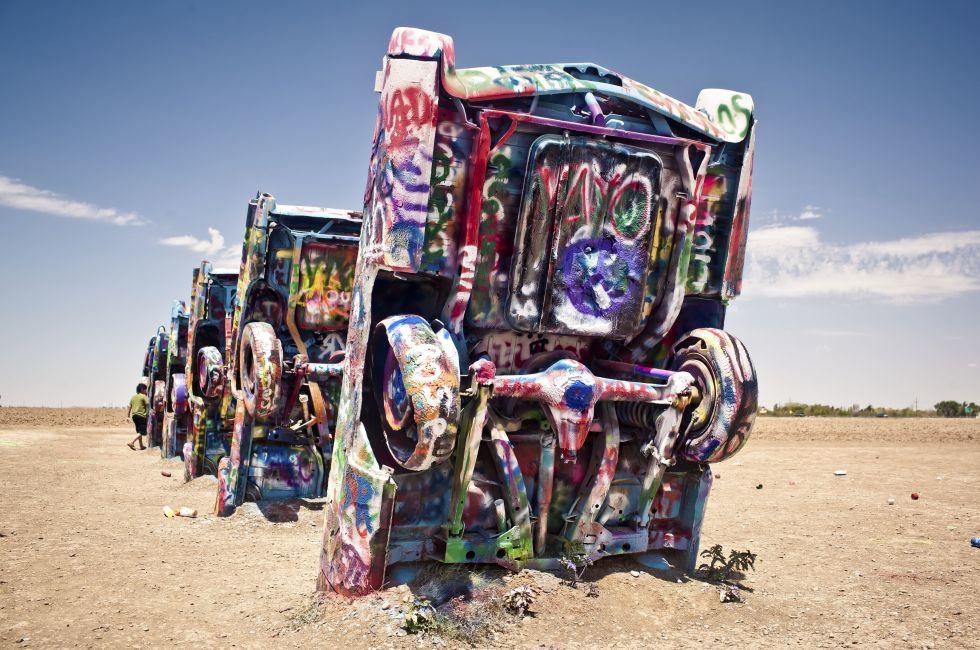 AMARILLO, TEXAS - JULY 10: Famous art installation Cadillac Ranch on July 10,2011 near Amarillo, Texas. It was created in 1974 by C. Lord, H. Marquez and D. Michels and consist from 7 buried Cadillacs; Shutterstock ID 93223765; Project/Title: AARP; Downloa