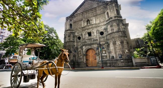 Horse Drawn Carriage parking in front of Malate church , Manila Philippines; 